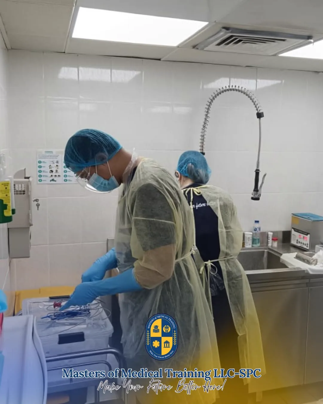 CSSD trainees in sterile gowns reprocessing instruments at the decontamination sink, MMT skills lab